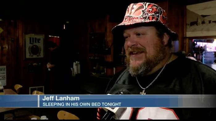 Screenshot from local news story on Bengals fan Jeff Lanham sleeping on roof